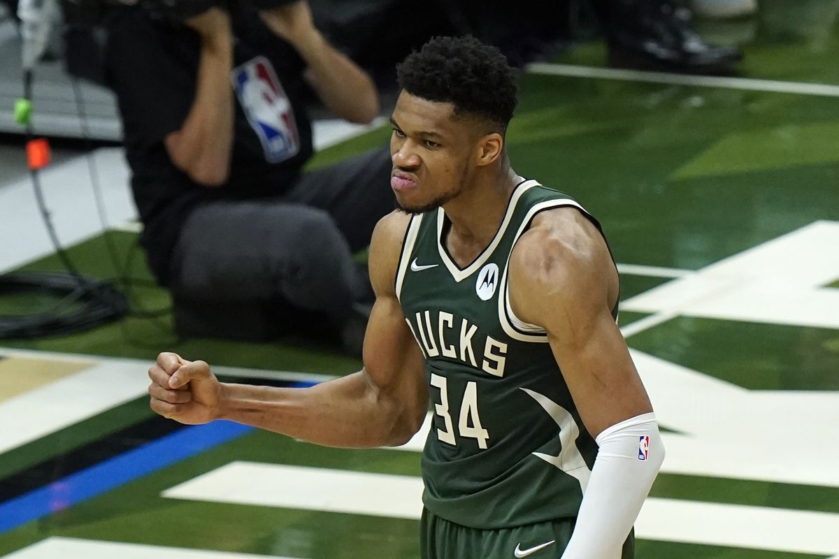 Milwaukee Bucks forward Giannis Antetokounmpo reacts to a basket against the Phoenix Suns during the first half of Game 3 of basketball