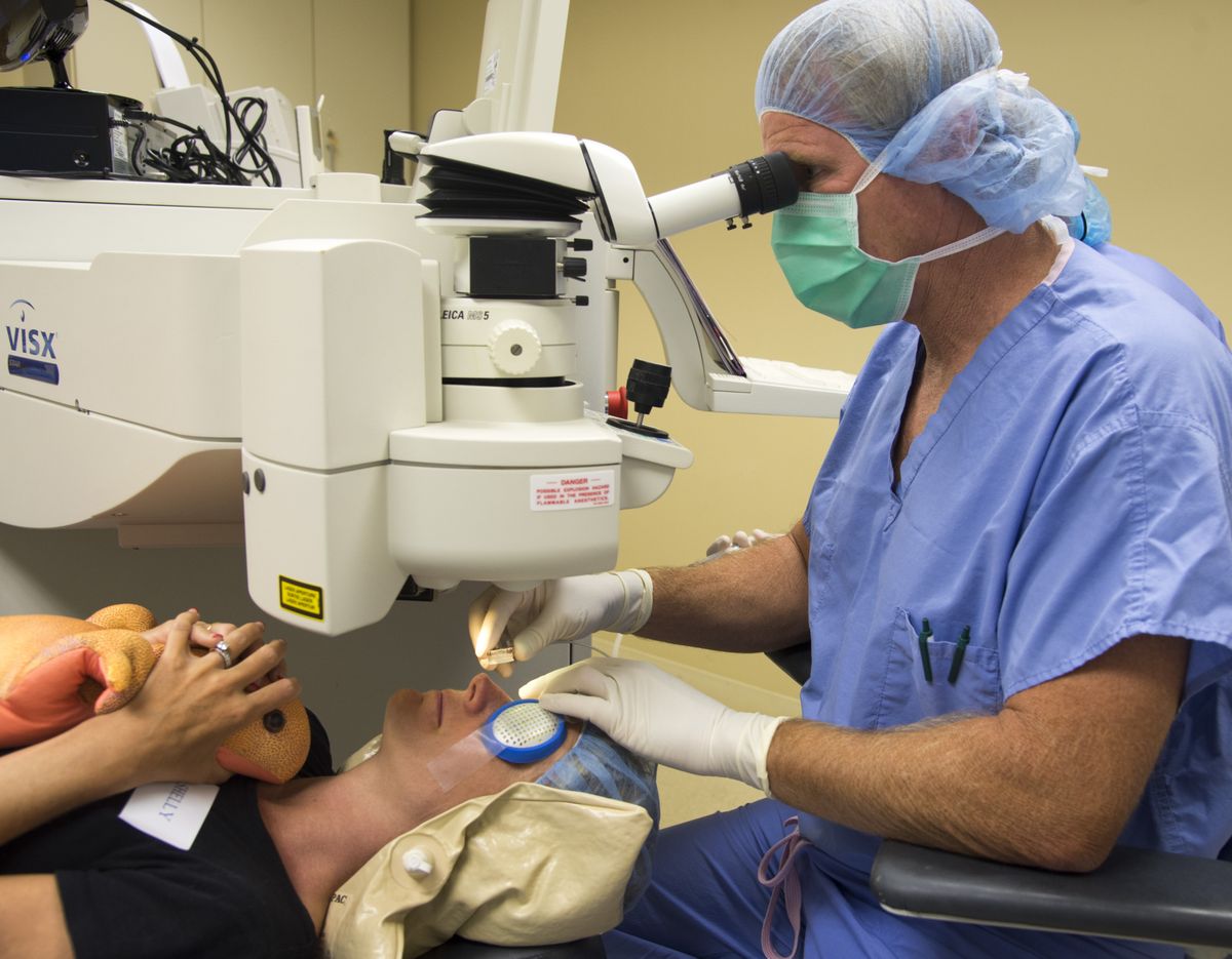 Dr. Mark Kontos performs Lasik eye surgery on patient Shelly Buckholz at Empire Eye Surgery on Aug. 15. Buckholz said she opted for the surgery because she “really hates wearing glasses.” (Colin Mulvany)