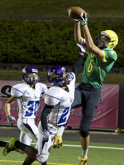 Shadle Park’s George Pilimai hauls in a touchdown pass. (Colin Mulvany)
