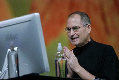 Apple Computer Inc. CEO Steve Jobs gestures during his keynote address at the MacWorld conference. 
 (Associated Press / The Spokesman-Review)