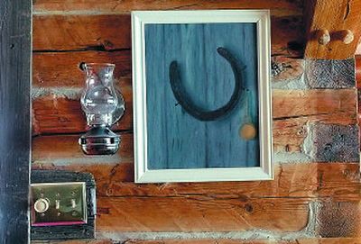 
In the living room Paul and Gayle Smith have exposed the timber walls and added barn board trim and antiques to the decor. 
 (photos by Jesse Tinsley/ / The Spokesman-Review)