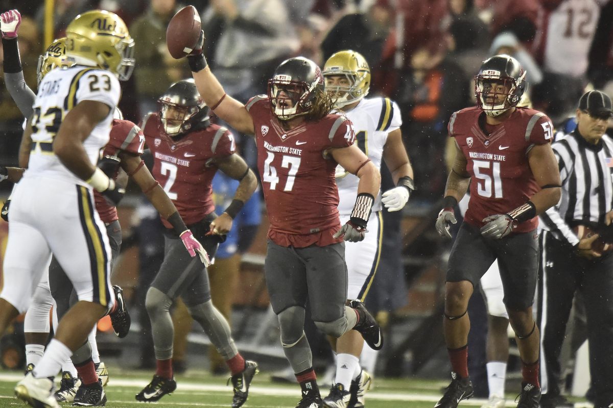 Washington State Cougars linebacker Peyton Pelluer (47) reacts after recovering a UCLA fumble during the first half of a PAC 12 college football game on Saturday, Oct 15, 2016, Martin Stadium in Pullman, Wash. (Tyler Tjomsland / The Spokesman-Review)