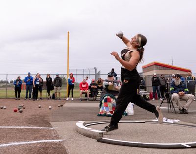 University’s Addy MacArthur makes her winning toss Friday in the State 3A girls shot put at Mount Tahoma High School in Tacoma. The mark of 43 feet, 53/4 inches held up for the following five throws.  (Joshua Hart/For The Spokesman-Review)