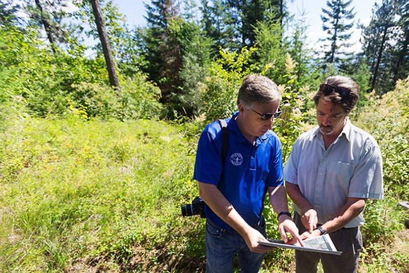 Rick Van Zandt, a Rathdrum business owner, right, discusses features of a map with Brett Boyer, city administrator, during a visit to the city���s property on Rathdrum Mountain. The city has plans to develop parts of mountain as a light recreation area for public use. (Shawn Gust/press)