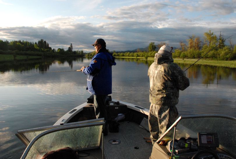 Anglers fish for northern pike in a slough off the Pend Oreille River, where the pike population grew a whopping 640 percent from 2004 to 2009. (File)