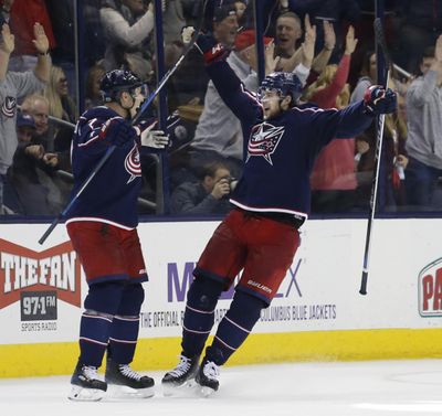 Columbus Blue Jackets' Josh Anderson, right, celebrates his goal against the Anaheim Ducks with teammate Jack Johnson during the third period of an NHL hockey game Friday, Dec. 1, 2017, in Columbus, Ohio. (Jay LaPrete / Associated Press)