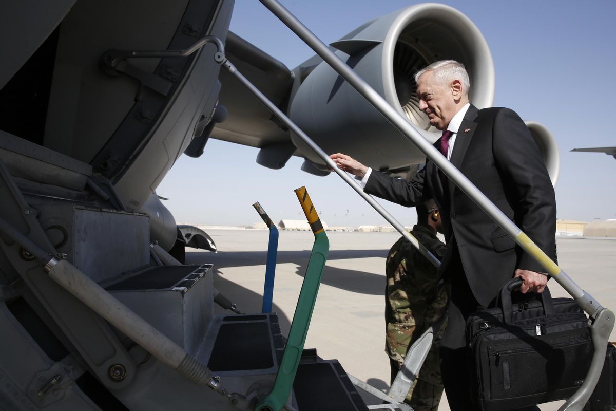U.S. Defense Secretary James Mattis boards a U.S. Air Force C-17 Globemaster for a day trip to a U.S. military base in Djibouti from Doha, Qatar, Sunday, April 23, 2017. (Jonathan Ernst / Associated Press)