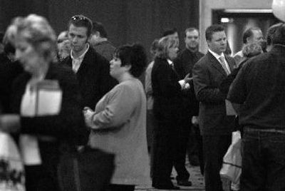 
Vendors and visitors mingle during the business fair hosted by the Greater Spokane Valley Chamber of Commerce on Wednesday at the Mirabeau Park Hotel. 
 (Jed Conklin / The Spokesman-Review)