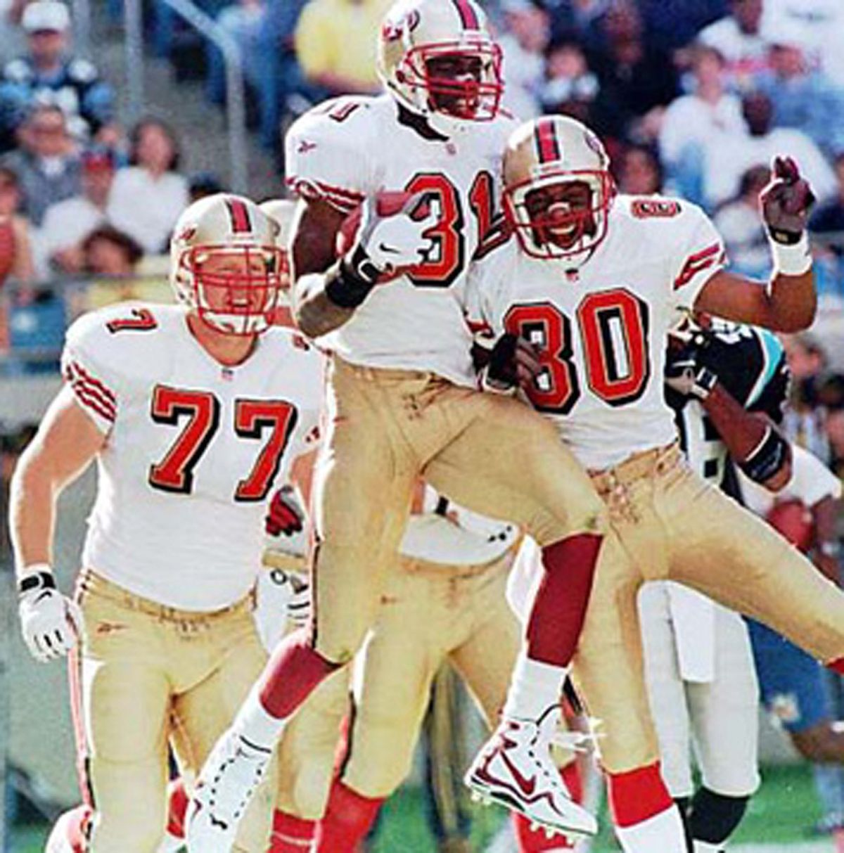 Tim Hanshaw, as a West Valley Eagle in the 1980s, and helping San Francisco 49ers teammates Terrell Owens (81) and Jerry Rice (80) celebrate a touchdown against the Carolina Panthers.Spokesman-Review archive,  (Photos: Spokesman-Review archive, Associated Press / The Spokesman-Review)