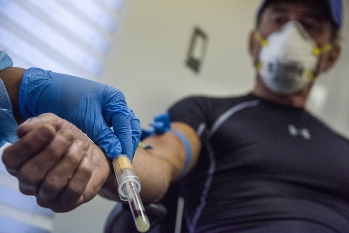 A nurse draws blood last month for an antibody test at a District of Columbia testing site. (Amanda Voisard/For the Washington Post )