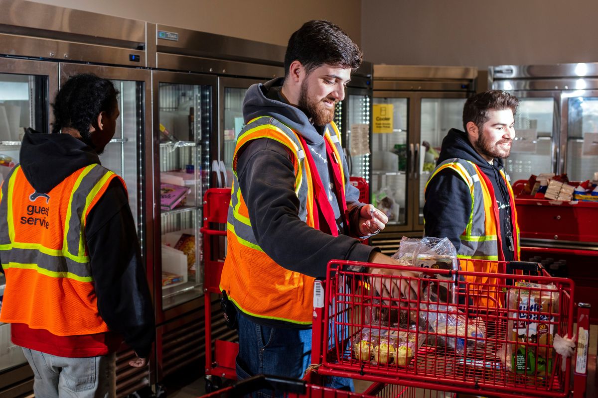 Workers in a backroom at a renovated Target store in Paramus, N.J., on April 7, 2026. The backrooms have been redesigned to make it easier for employees to prepare items for pickup.   (Bryan Anselm/The New York Times)