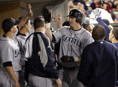 
Richie Sexson (facing) is congratulated after hitting the first of two homers against the White Sox. 
 (Associated Press / The Spokesman-Review)