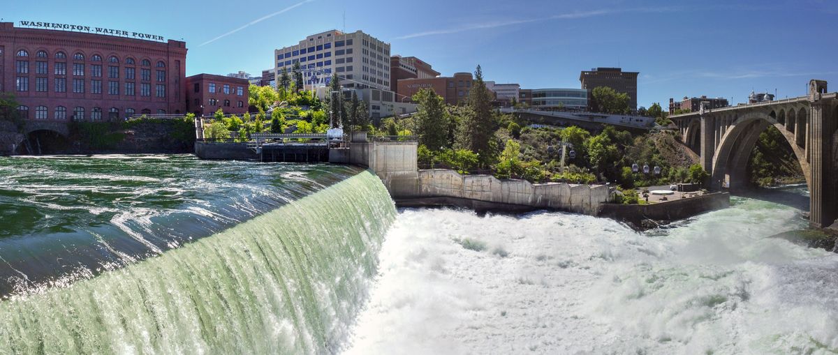 The high spring water flows thunder over the dam of the Monroe Street Project of the Washington Water Power Company. The dam was rebuilt in 1973 after 80 years of river flows caused some of the rock crib dam to wash away. The dam stores water above the intake of the massive generator at the bottom of the falls, which is now underground, hidden beneath a steel cover that visitors can walk around in Huntington Park, the landscaped hillside area next to the thundering falls.  (Jesse Tinsley/THE SPOKESMAN-REVIEW)