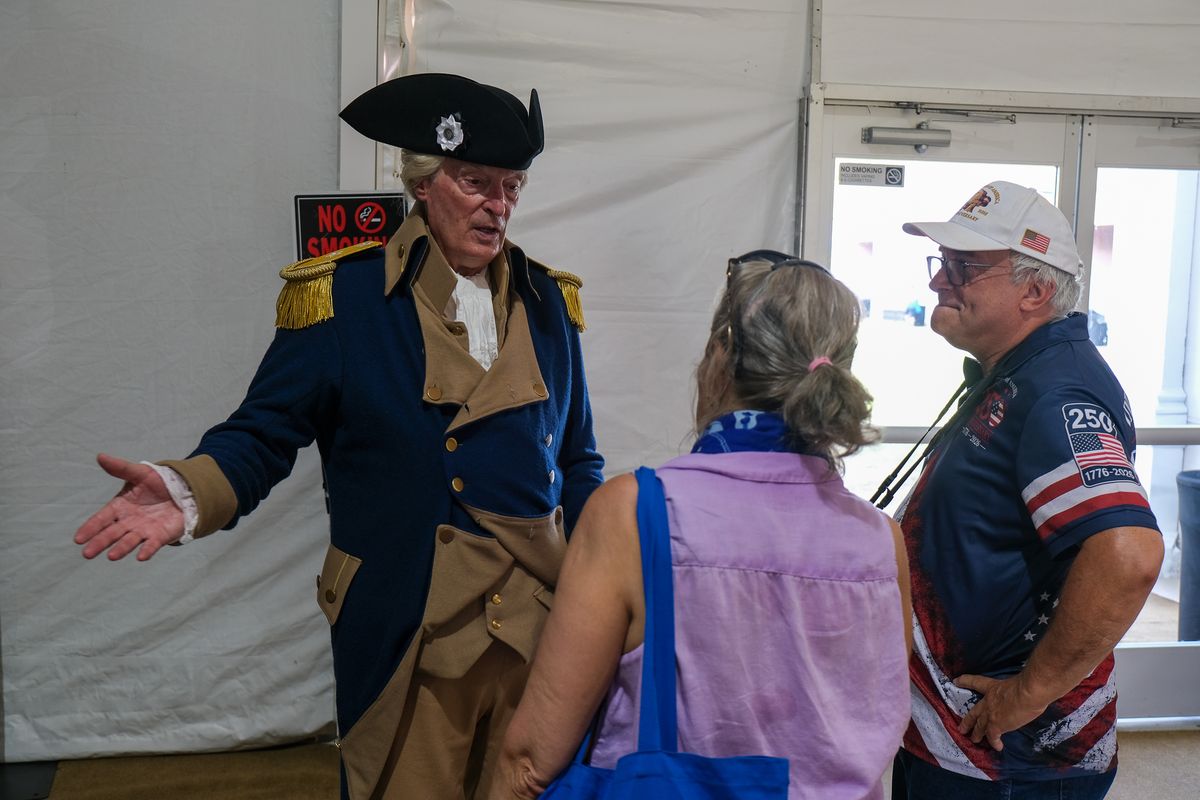 A George Washington impersonator talks with attendees at the Great American State Fair in Washington, D.C., on July 1, 2026.  (Orion Donovan Smith/The Spokesman-Review)