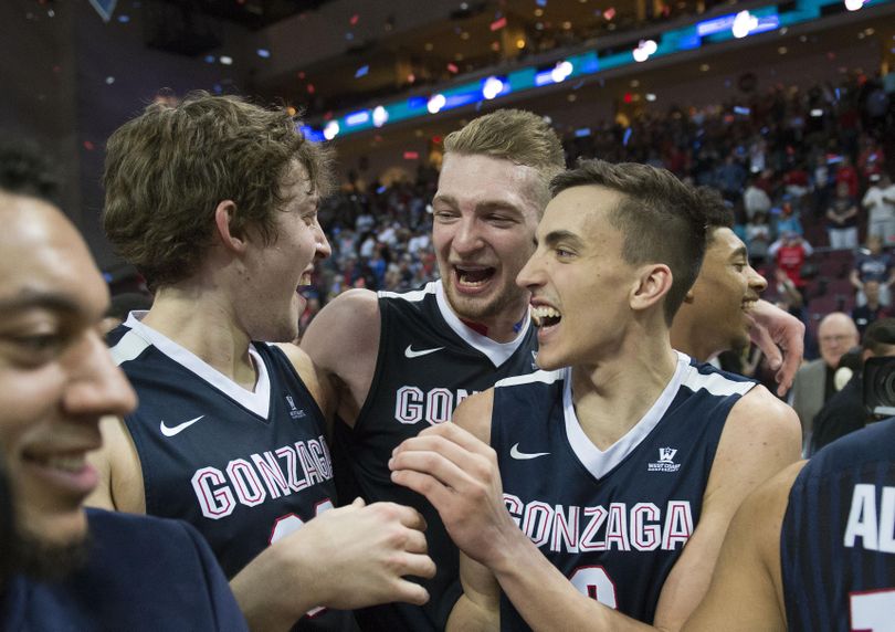 Left to right, Gonzaga’s Kyle Wiltjer, Domantas Sabonis and Kyle Dranginis celebrate their 85-75 win over Saint Mary's at the end of the West Coast Conference tournament championship on Tuesday, March 8, 2016. (Colin Mulvany / The Spokesman-Review)