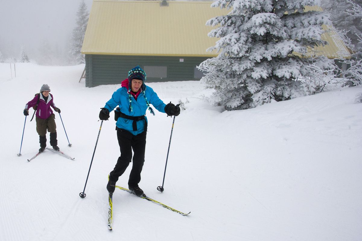 Amina Giles, right, and Paula Southerlin make their way from the Selkirk Lodge to the cross-country trails Thursday on Mount Spokane. “I come as often as they groom the trails,” Giles said. Gov. Jay Inslee has budgeted money for an expansion of the lodge and other upgrades to the area. (Dan Pelle)
