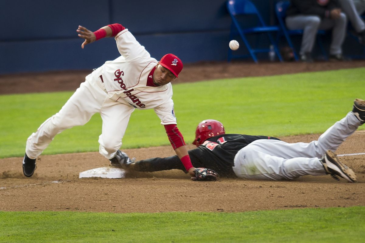 Vancouver’s Dalton Pompey steals third before scoring on an errant throw to third baseman Smerling Lantigua in the fifth inning. (Colin Mulvany)