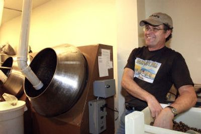 
Rob Hilles of Hazelnut Hill near Monroe, Ore., describes the process of coating the nuts with chocolate to achieve a coated and glazed nut shortly after it's shelled. Though the hazelnut harvest is usually around Oct. 1, Christmas is the busiest season at Hazelnut Hill.
 (Associated Press / The Spokesman-Review)