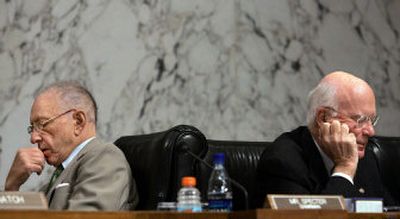 
Senate Judiciary Committee Chairman, Sen. Arlen Specter, R-Pa., left, and Sen. Patrick Leahy, D-Vt., ranking Democrat on the committee, go over notes separately during the confirmation hearing for Chief Justice nominee John Roberts Thursday. 
 (Associated Press / The Spokesman-Review)