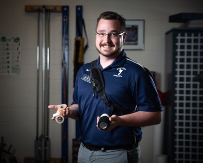 Athletic trainer Aaron Kilfoyle takes a portrait in his training room in Building 5 of the Spokane Community College campus on June 23. Kilfoyle, who is from Tacoma but earned his undergraduate degree from Whitworth University, diagnoses and rehabilitates student athletes who experience sports injuries.  (Libby Kamrowski/The Spokesman-Review)