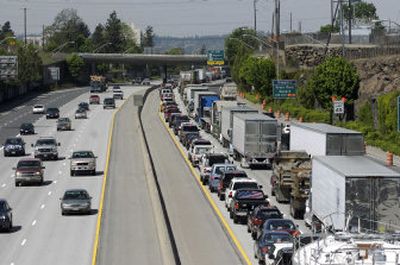 
A 10 a.m. accident involving a Washington State Patrol trooper in the westbound lanes on I-90 near the Garden Springs exit backed up traffic for miles. 
 (Colin Mulvany / The Spokesman-Review)