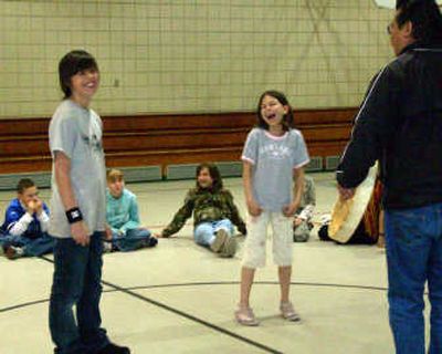 
Jerry Wisner and Ericka Rickards learn traditional Native American dances from Gary Fox,  of the Saulteaux tribe. 
 (Lisa Leinberger / The Spokesman-Review)
