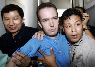 
John Mark Karr, in police custody in Bangkok on Thursday, has confessed to killing JonBenet Ramsey in 1996, but some experts have their doubts about his story. 
 (Associated Press / The Spokesman-Review)