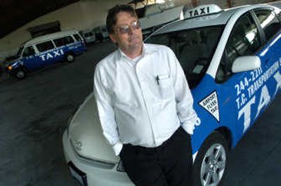 
Ron Davis, COO for TC Transportation Services, enhanced his taxi fleet with Prius hybrids. 
 (Dan Pelle / The Spokesman-Review)