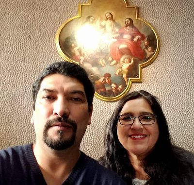 In this Dec. 2017, photo provided by Rachel Tovar, right, poses with her husband Arturo Tovar at a Catholic cathedral in Mexico City. (Associated Press)