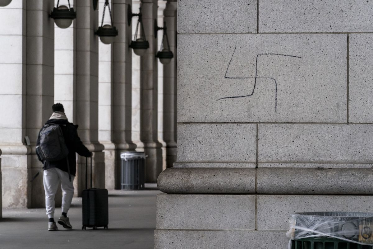 A hand-drawn swastika is seen on the front of Union Station near the Capitol in Washington, Friday, Jan. 28, 2022. (J. Scott Applewhite)