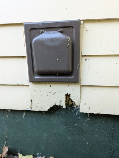 Rainwater splashing up from the gravel just below this dryer vent outlet is the primary cause of this wood rot. My guess is the painter never coated the bottom edge of the wood block, allowing water to soak into the end grain.  (Tribune Content Agency)