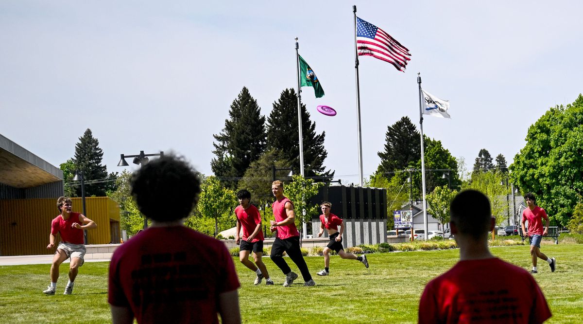 Students from Spokane Valley Tech play ultimate frisbee at Balfour Park on Wednesday. Expansion plans for the park include a new playground, basketball and pickleball courts, and an amphitheater.  (Kathy Plonka/The Spokesman-Revie)