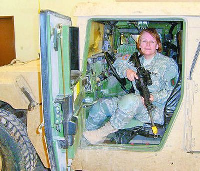
Terri Fowler poses in a Humvee during training in March in Ft. Riley, Kan. 
 (Photo courtesy of Terri Fowler / The Spokesman-Review)