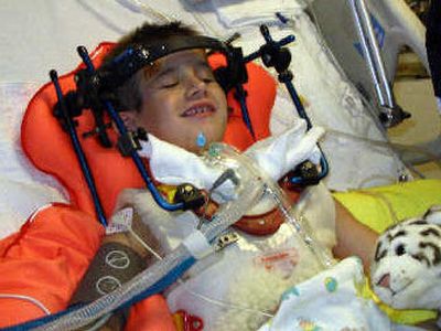 
Zak Baldwin was riding a motorized dirt bike July 23 when the 7-year-old was struck by a car. Now 8, Zak is at Seattle Children's Hospital. A benefit dinner/auction for Zak is planned for Sunday at Northern Quest Casino.  
 (Photo courtesy of the Baldwin family / The Spokesman-Review)