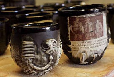 
 Fired and finished cups bearing symbols and images of war sit in a workshop in Berkeley, Calif. 
 (Associated Press photos / The Spokesman-Review)