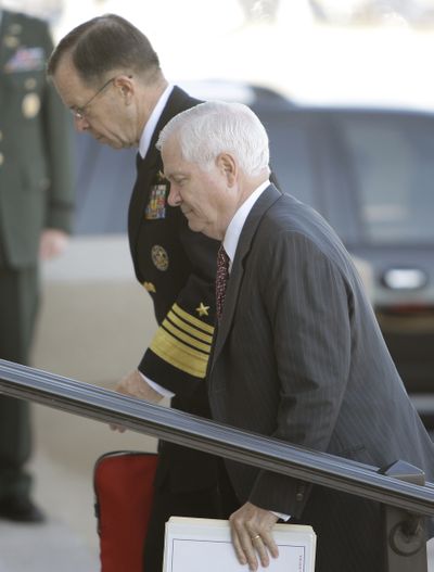 Joint Chiefs Chairman Adm. Michael Mullen, left, and Defense Secretary Robert Gates arrive at the Pentagon on Thursday after a meeting at the White House to discuss Afghanistan.  (Associated Press / The Spokesman-Review)