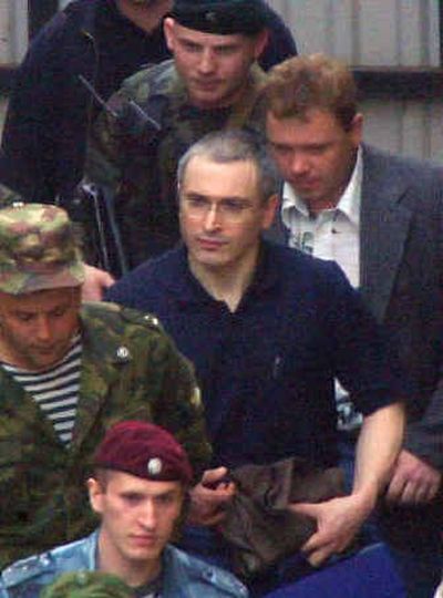 
Russian oil tycoon Mikhail Khodorkovsky, center, leaves a Moscow court Tuesday. 
 (Associated Press / The Spokesman-Review)