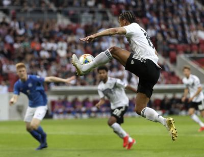 Germany’s Leroy Sane jumps for the ball during a Group C soccer qualifying match between Germany and Estonia in Mainz, Germany, Tuesday, June 11, 2019. (Michael Probst / Associated Press)
