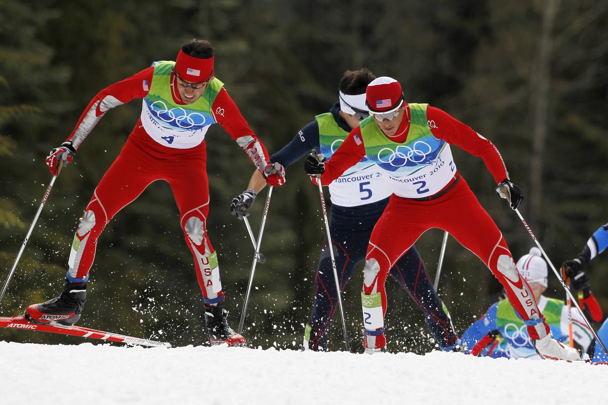 Johnny Spillane of the U.S., left, Jason Lamy Chappuis of France, center, and Todd Lodwick of the U.S. ski during the cross country portion of the Nordic combined normal hill event. (Associated Press)