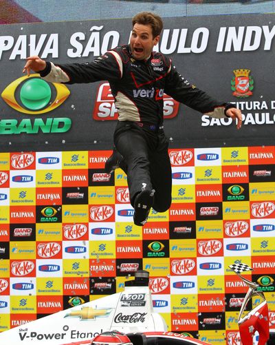 Will Power jumps for joy after tasting victory in Brazil for a third straight season. (Associated Press)