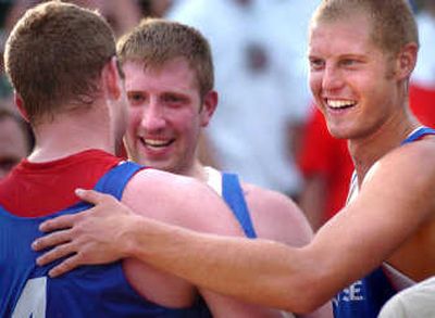 
Lance Den Boer, right, Kyle Boast, center, and Tyler Mitchell celebrate their victory in the Hoopfest Over 6' Men's Elite Division final. The Spokesman Review
 (INGRID LINDEMANN The Spokesman Review / The Spokesman-Review)