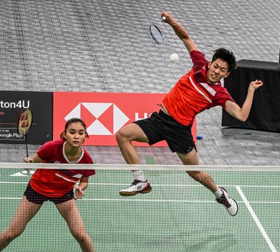 Arthur Lee, of Team USA, smashes an overhead shot to beat Peru on Monday morning during the Badminton World Federation’s 2023 World Junior Championships at the Podium in Spokane.  (DAN PELLE/THE SPOKESMAN-REVIEW)