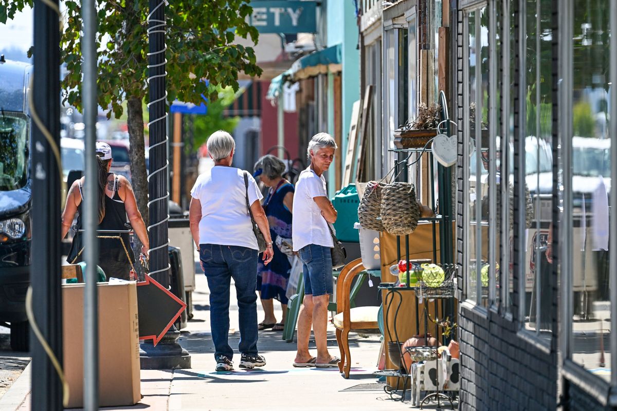 Bargain hunts shop the antique stores on Market Street in Hillyard, Thursday, Aug. 3, 2023.  (DAN PELLE/THE SPOKESMAN-REVIEW)