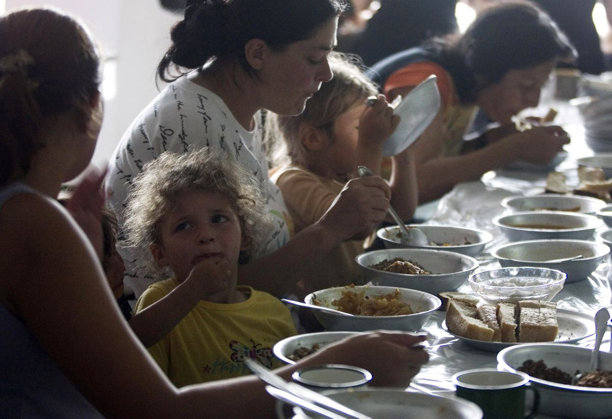 South Ossetian people, driven out of their homes by fighting, eat in a canteen in a refugee camp in the town of Alagir,  in the Russian province of North Ossetia, on Wednesday.  (Associated Press / The Spokesman-Review)