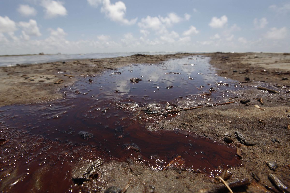 Oil from the Deepwater Horizon oil spill washes ashore on Elmer’s Island in Grand Isle, La., on Friday.  Associated Press photos (Associated Press photos)