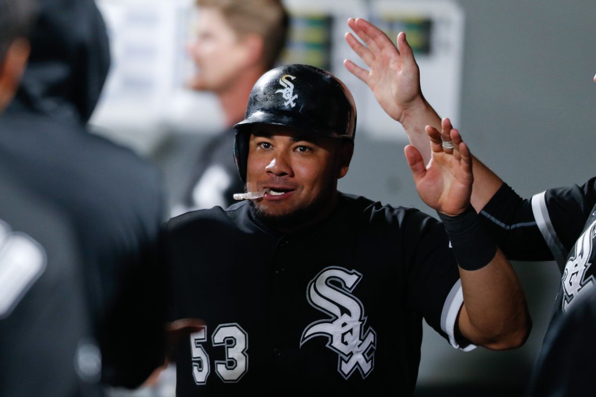 Chicago’s Melky Cabrera is congratulated after scoring on a passed ball in the 10th inning. (Associated Press)