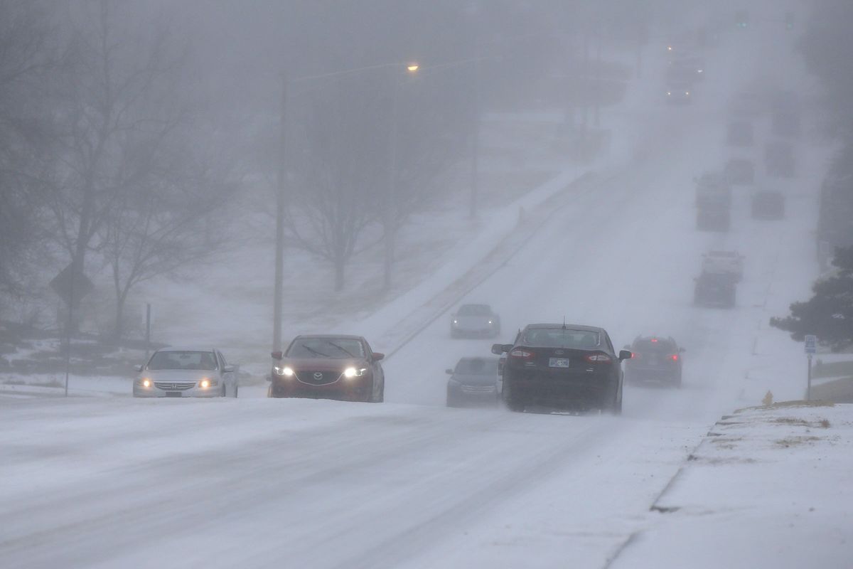 Motorists drive during a sleet storm in Tulsa, Okla,, Wednesday, Feb. 23, 2022.  (Stephen Pingry)