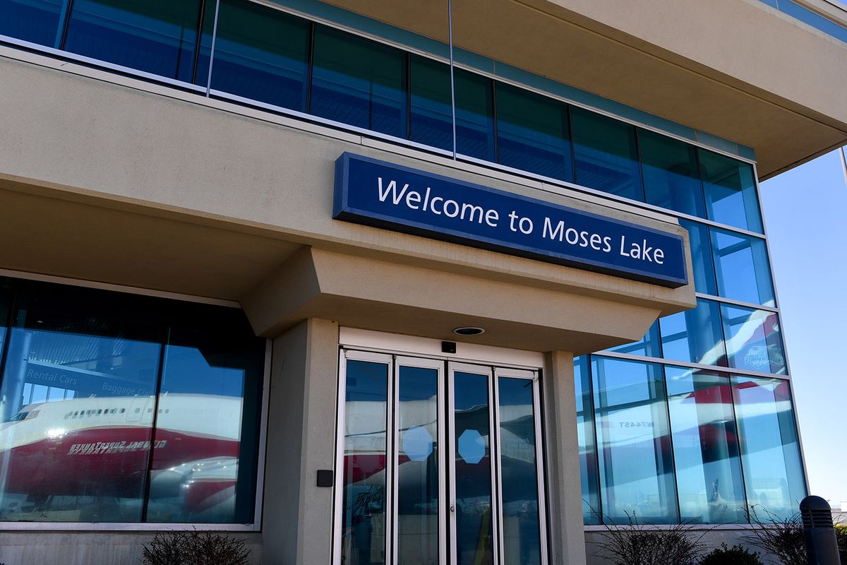 A Global Supertanker is reflected in airport glass as it awaits media and dignitaries during a wildfire response demonstration hosted by AreoTEC on Tuesday, March 23, 2021, at Grant County International Airport in Moses Lake, Wash. The Global Supertanker is the worlds largest firefighting air tanker with the capability to drop more than 19,000 gallons of fire retardant or water. Washington DNR is hoping to call on the Global Supertanker if needed during the 2021 wildfire season.  (Tyler Tjomsland/The Spokesman-Review)