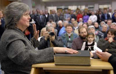 
 Bonnie Mager is sworn in as a Spokane County commissioner on the second floor of the downtown Spokane Public Library on Wednesday before a room full of supporters. Mager defeated three-term incumbent Phil Harris. 
 (Dan Pelle / The Spokesman-Review)