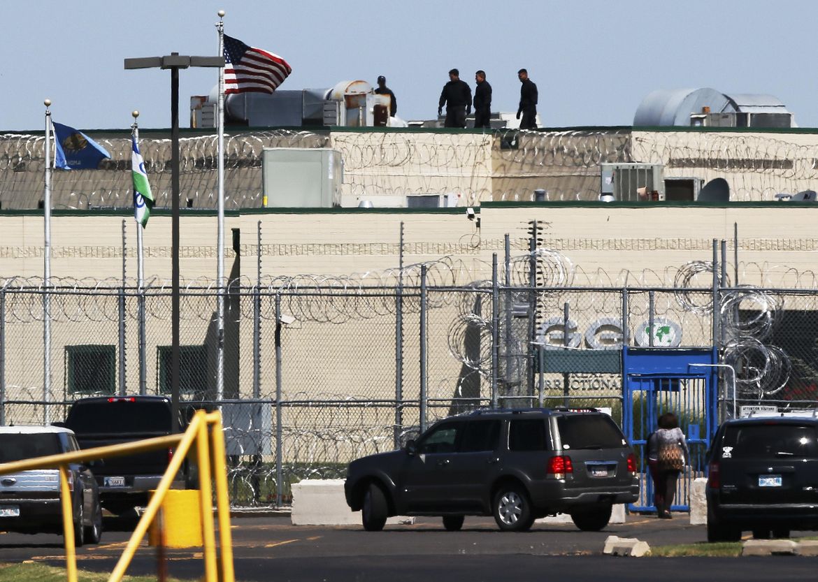 Inmates take two guards hostage in Oklahoma prison riot | The Spokesman ...